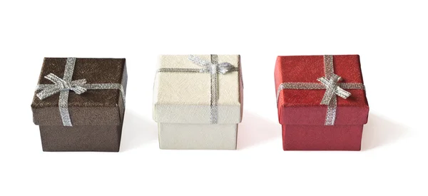 Three gift boxes with silver ribbon