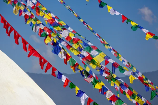 Tibetan Buddhist Prayer Flags Lungta at giant buddhist stupa Boudnath in Kathmandu Himalaya Nepal