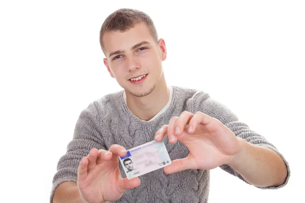 Young man showing his driver license
