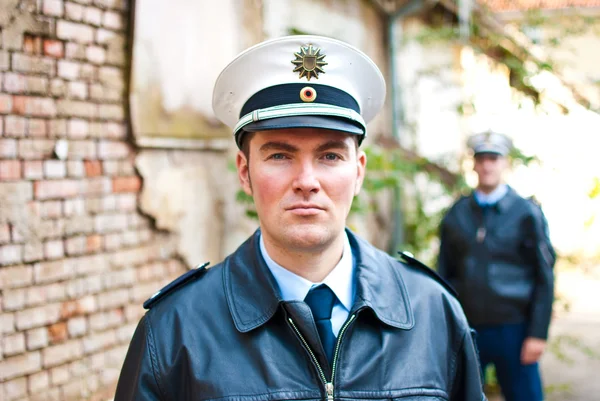 Police officer is looking into camera