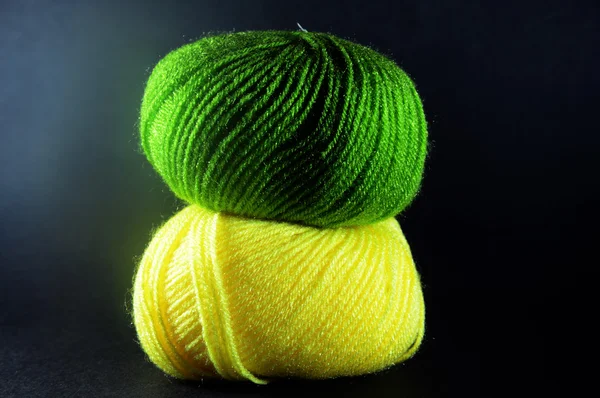 Two Green and Yellow Balls of Wool