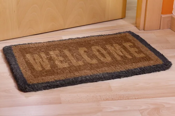 Welcome home doormat with open door