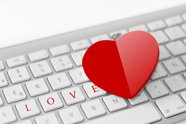 Red heart on keyboard. Love concept