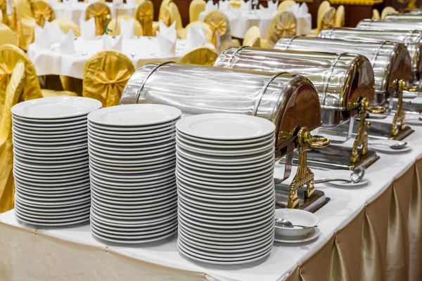 Dishes and warming trays for buffet line