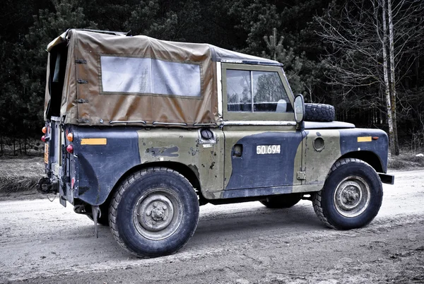 Old Land Rover Defender driving off road