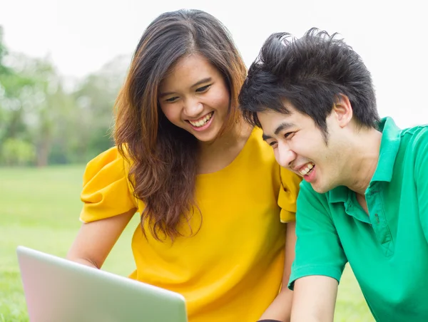 Young people hanging out in the park.