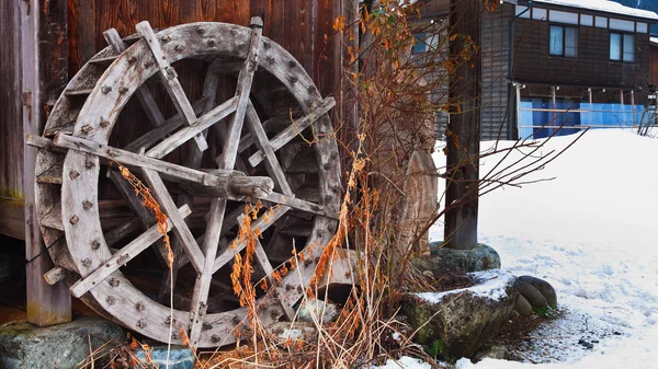 Wood Water wheel by a Cottage at the Ogimachi Village in Shirakawago