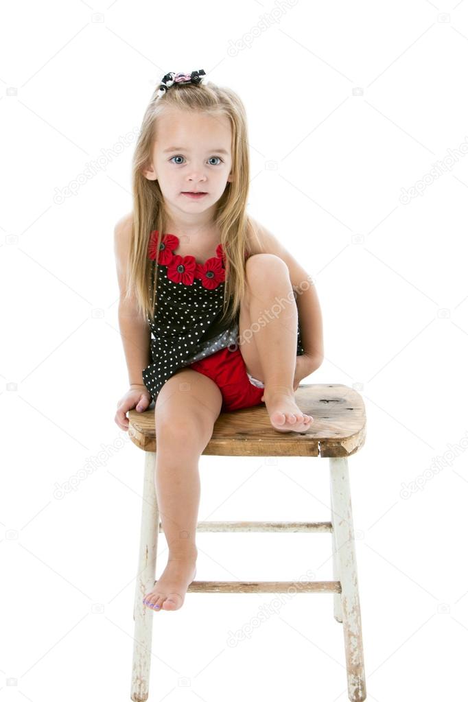 Little Girl Sitting In Bed