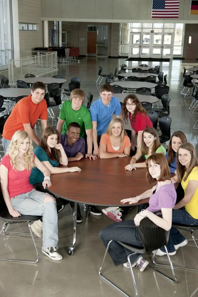 Education. Group of teenage high school students together as friends or a team, in colorful clothes