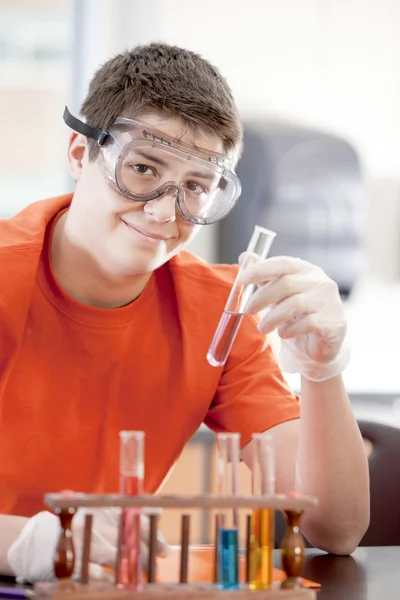 School Science. Hispanic teenage high school student learning about chemistry in science clas