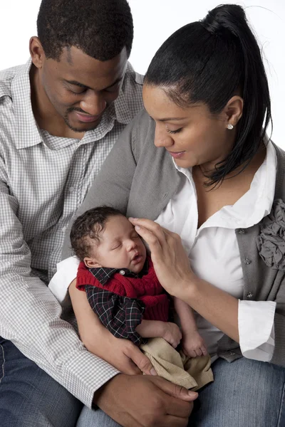 African american mother and father holding their newborn baby boy