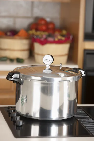 Canning. Pressure cooker used for canning homegrown fruits