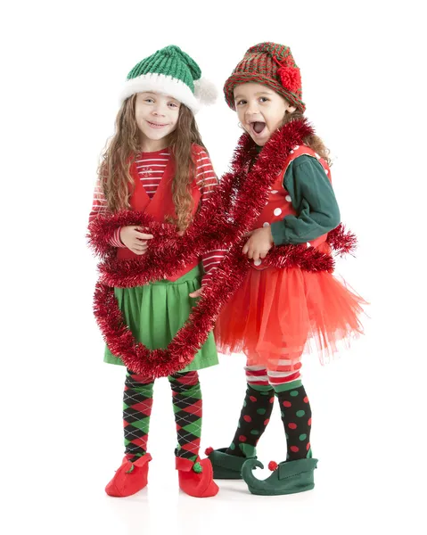 jóvenes elfos de Navidad enredan en garland — Imagen de stock #21427425 jóvenes elfos de Navidad enredan en garland — Imagen de stock #21427425