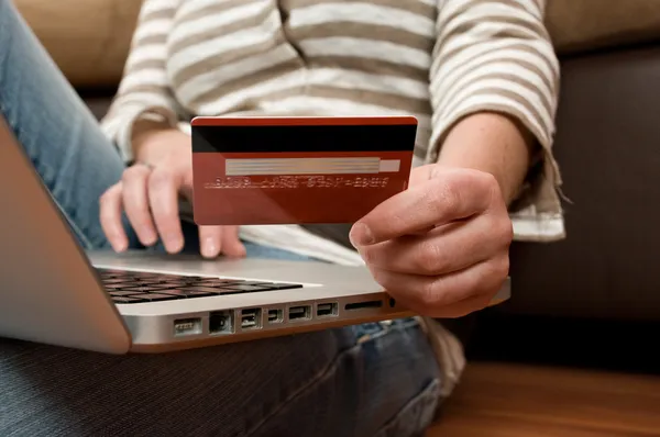 Beautiful young girl shopping online, e-commerce concept