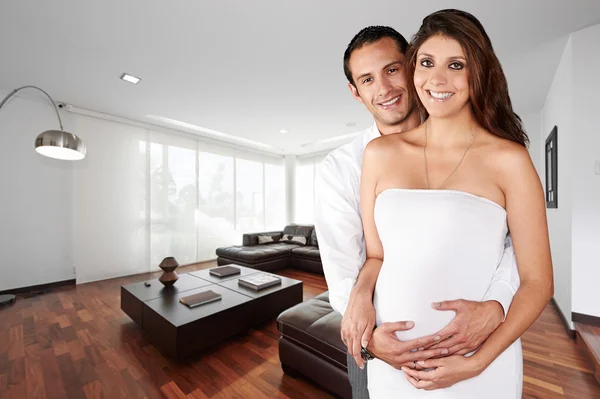 Pregnant couple at new big empty modern department