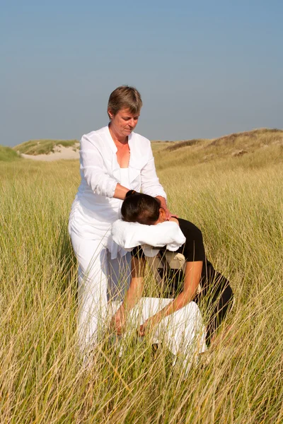 Chair massage in the dunes on the island Ameland, the Netherlands