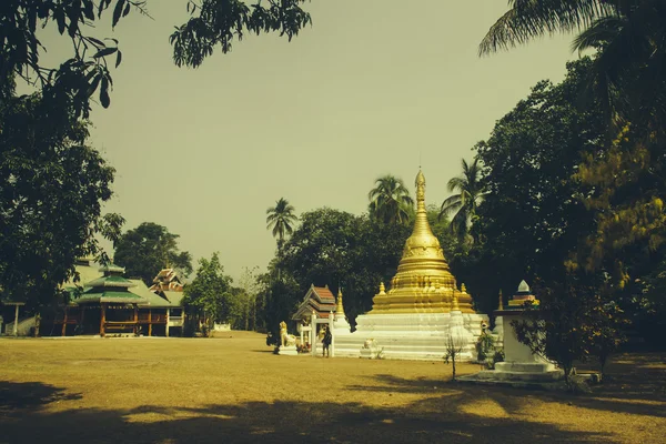 Golden thai buddhist temple in the village of Pai Mae Hong Son