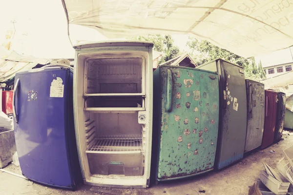 Old Refrigerators Waiting to Be Scrapped At a Recycling Center