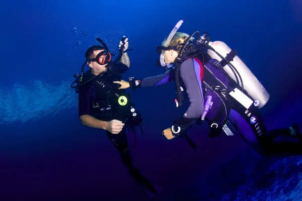 Scuba diving instructor and student