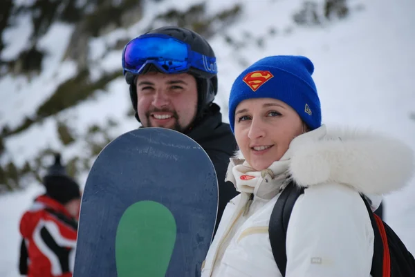 Group of young people on the mountain top Todorka Bansko ski resort in Bulgaria