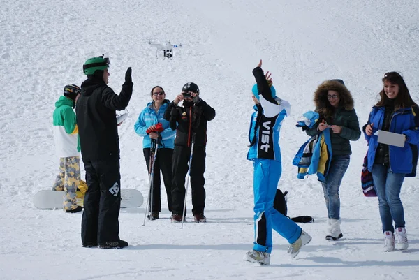 Group of young people on the mountain top Todorka Bansko ski resort in Bulgaria
