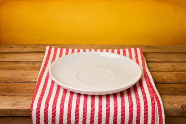 Empty plate on tablecloth