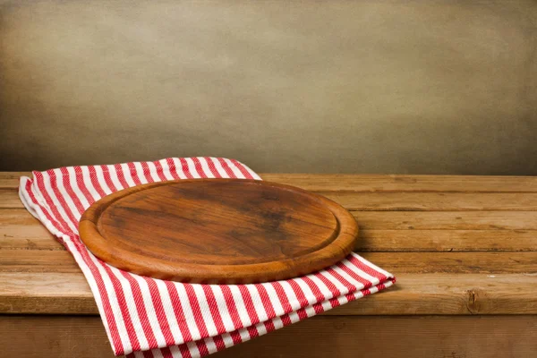 Wooden board stand on tablecloth