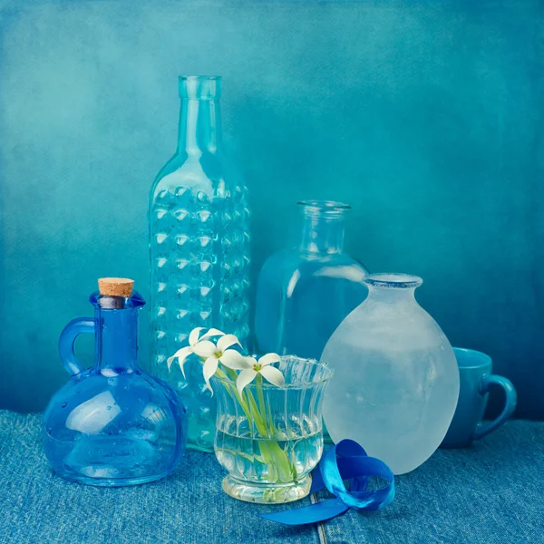 Still life with bottles in blue tones