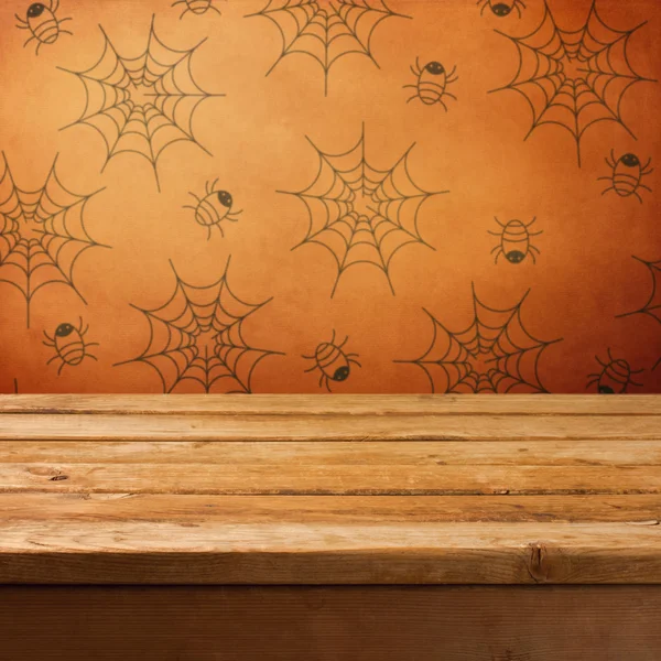 Halloween holiday background with empty wooden table