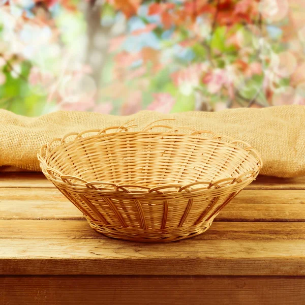Empty basket on wooden table