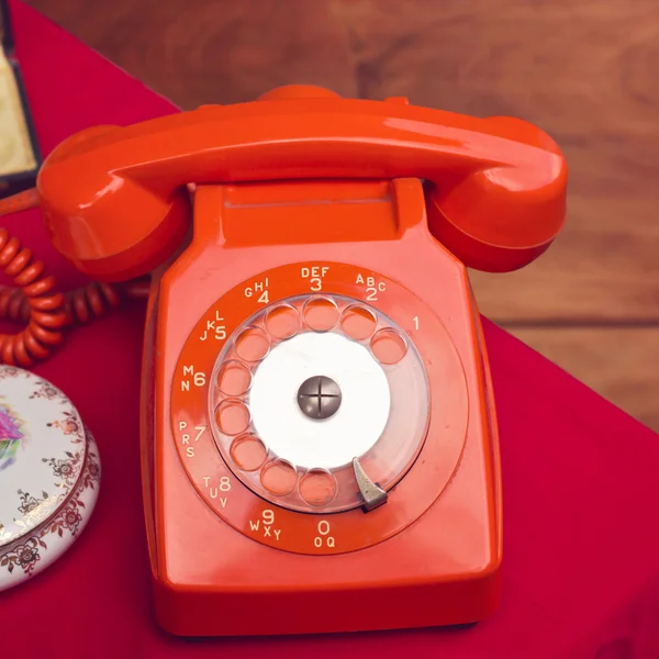 Vintage rotary telephone on table