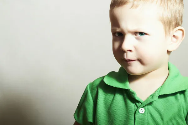 Child. Little Boy with Blue Eyes. Close-up Portrait of Funny Kid.Children emotion