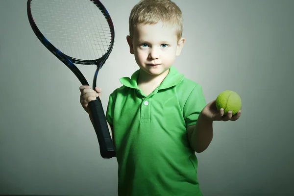Young Boy Playing Tennis. Sport Children. Child with Tennis Racket and Ball