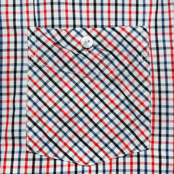 A front pocket of the shirt.