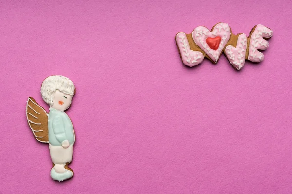 Cookies with the text of love and couple of angels on Valentine's day