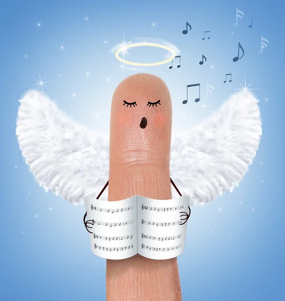 Singing angel on finger — Stock Photo #35215987