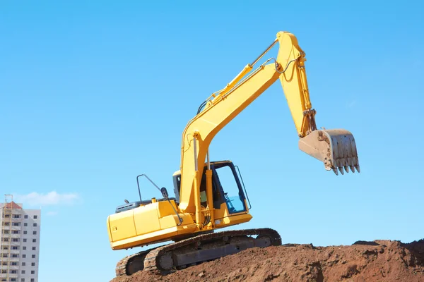 Yellow Excavation Machine On Heap Of Soil