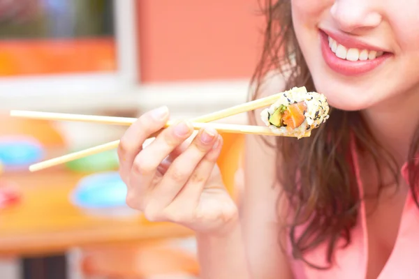 Female Eating Sushi