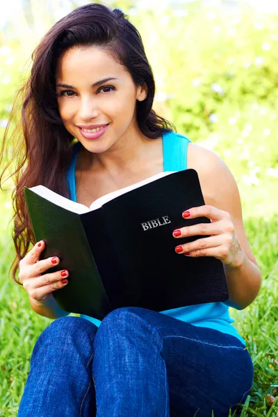 Young Woman Holding a Bible