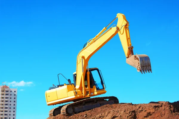 Yellow Excavation Machine On Heap Of Soil