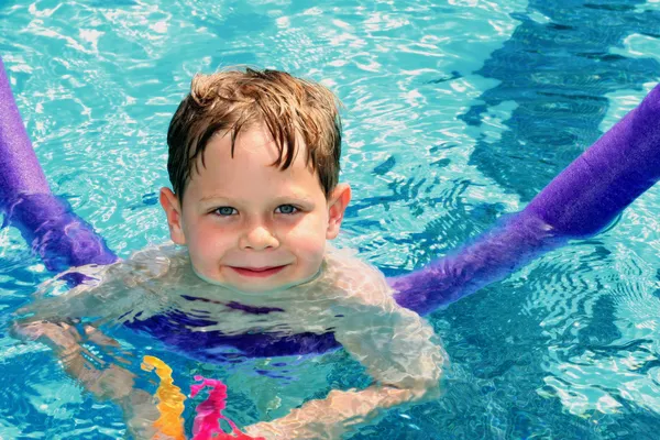 Child learning to swim