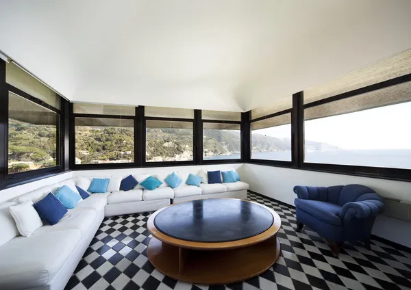 Large living room with white sofa and panoramic view