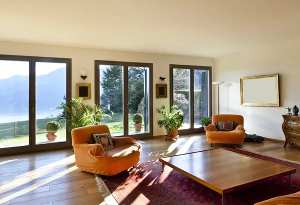 Living room with orange armchairs
