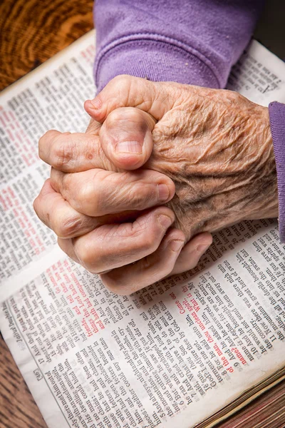 Elder Woman\'s Hands on Bible