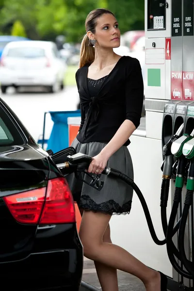 Woman refuel car