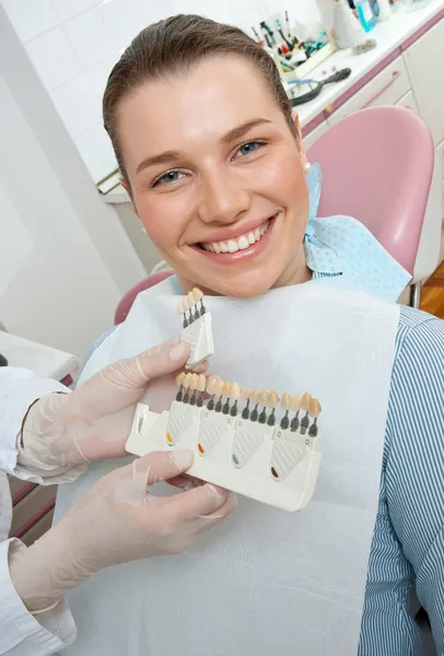Woman choosing dental cover