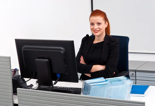 Red hair business woman in office