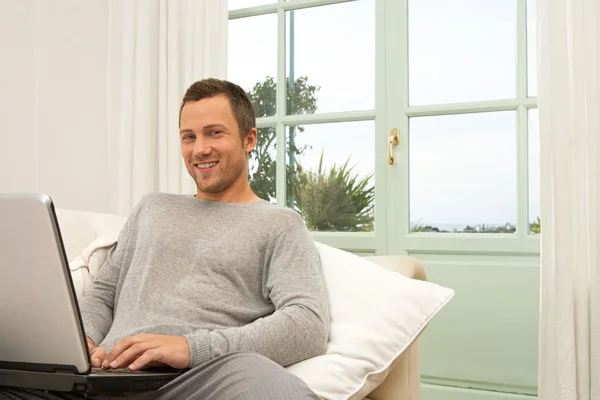 Man using a laptop computer — Stock Photo #19802923