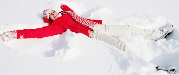 Woman laying down on the snow