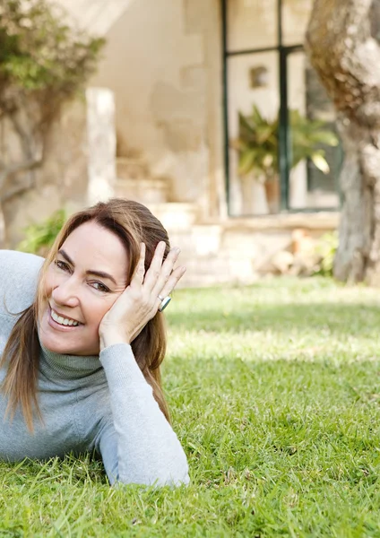 Woman laying on grass